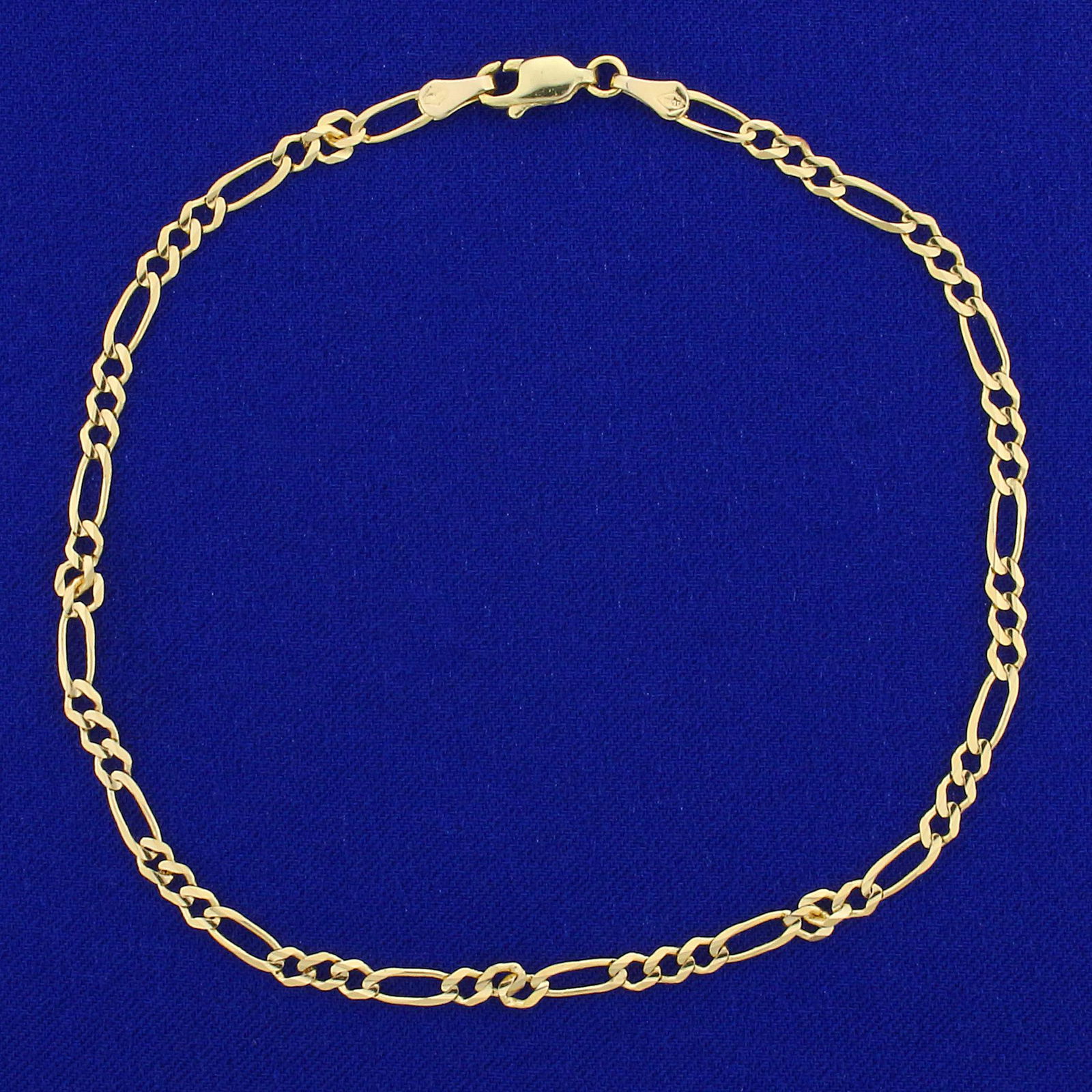 Figaro Link Anklet in 14K Yellow Gold: In 14K Yellow Gold. 10 inches long, 3mm wide. Lobster clasp. 3.6g.