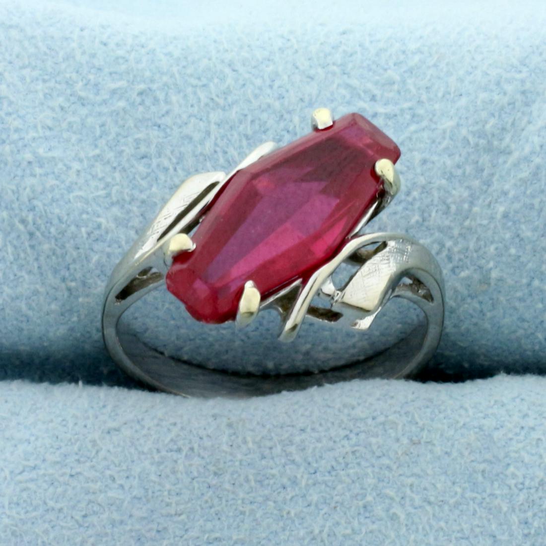 3ct Lab Ruby Solitaire Ring in 10K White Gold: In 10K White Gold. Contains one high quality natural 15x7mm Lab Ruby gemstone with perfect ruby red color and excellent clarity. Size 7 1/2. 3.3g