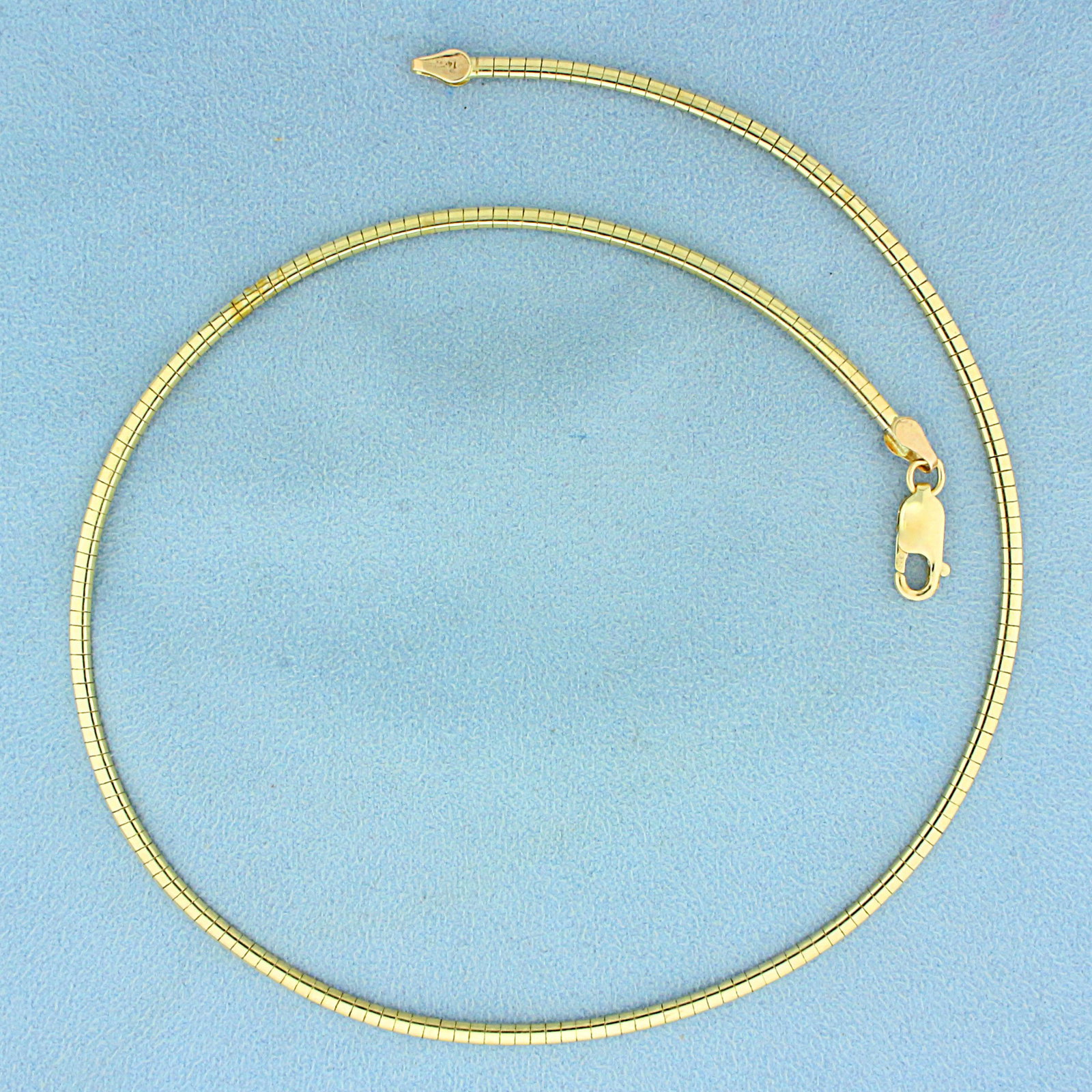 16 Inch Thin Omega Necklace in 14K Yellow Gold: In 14K Yellow Gold. Contains lobster clasp. 16 inches long. 2.4mm wide. 13.4g