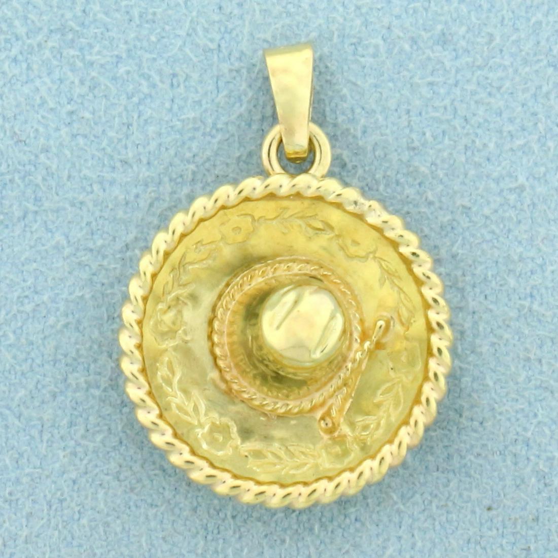 Mexico Sombrero Pendant or Cham in 14K Yellow Gold: In 14K Yellow Gold. 1 inch long including bale. 3/4 inch wide. 2.5g