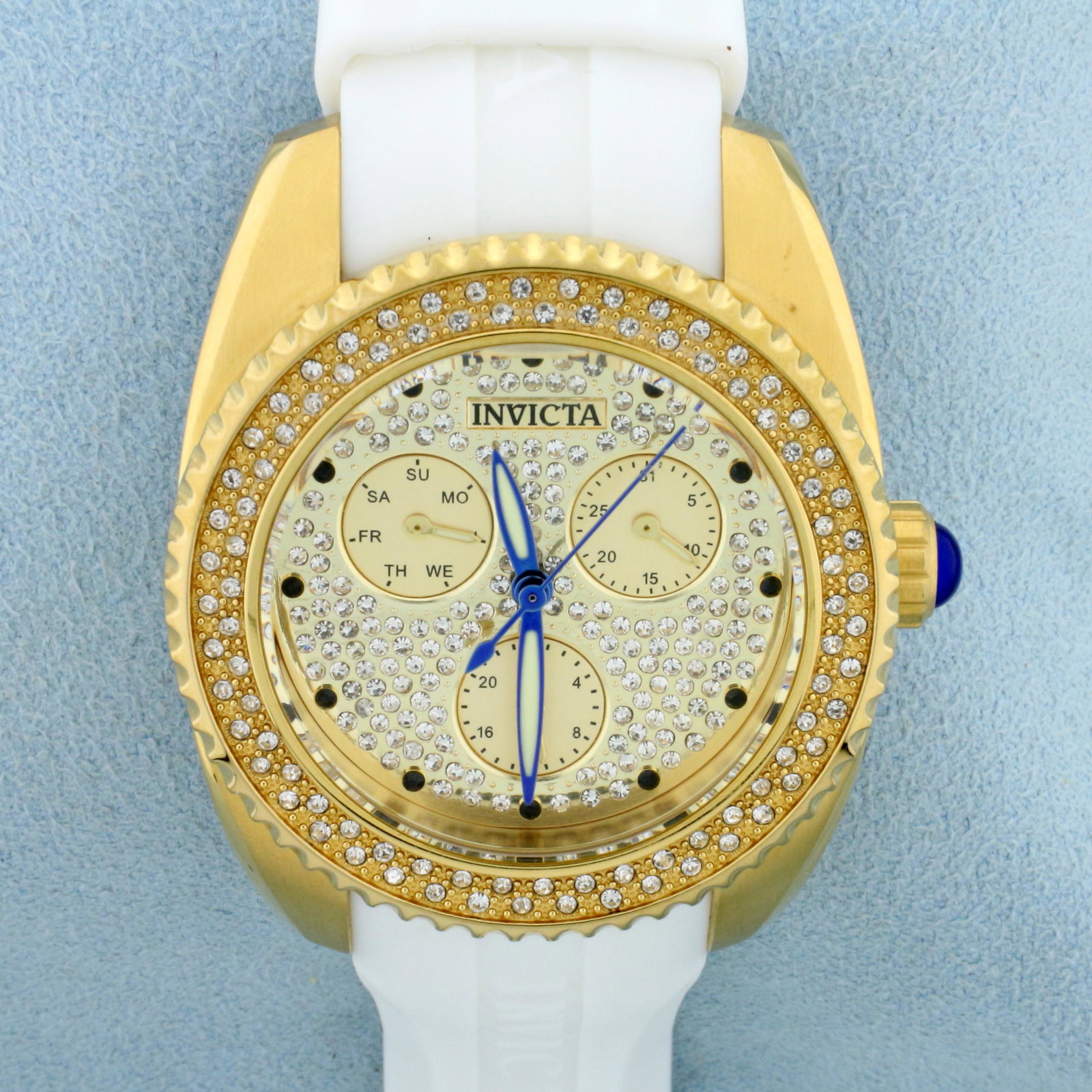 Womans Angel Invicta Watch in Stainless Steel: In Stainless Steel. Model 28484 Water Resistant 100M. New Battery, runs great and in excellent condition. Silicone Band. With Box and Papers.