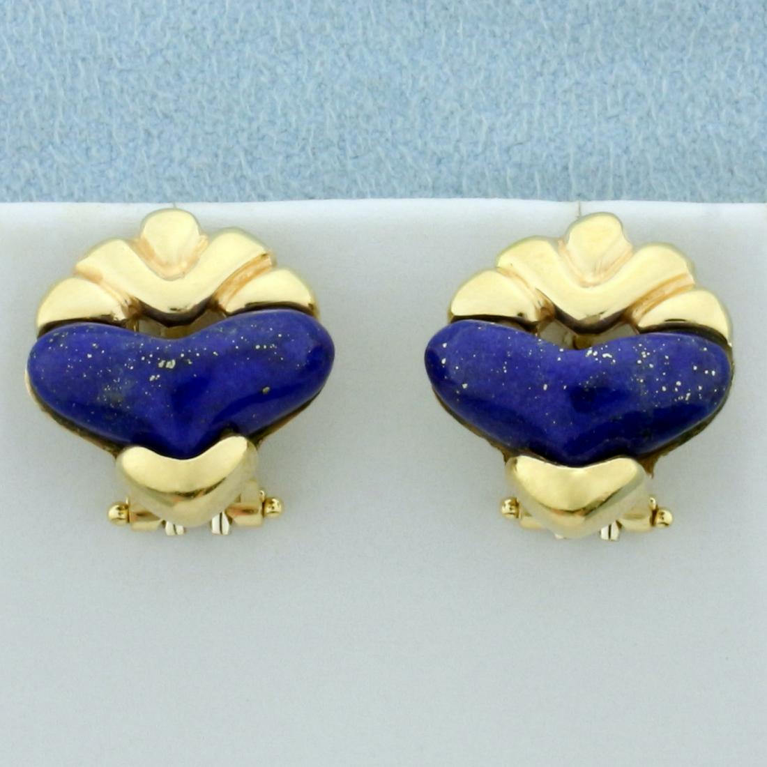 Heart Shaped Lapis Lazuli Earrings in 14K Yellow Gold: In 14K Yellow Gold. Each earring contains one high quality natural 15mm heart cut Lapis gemstones with deep royal blue color and flecks of gold. French omega backs. 7.1g