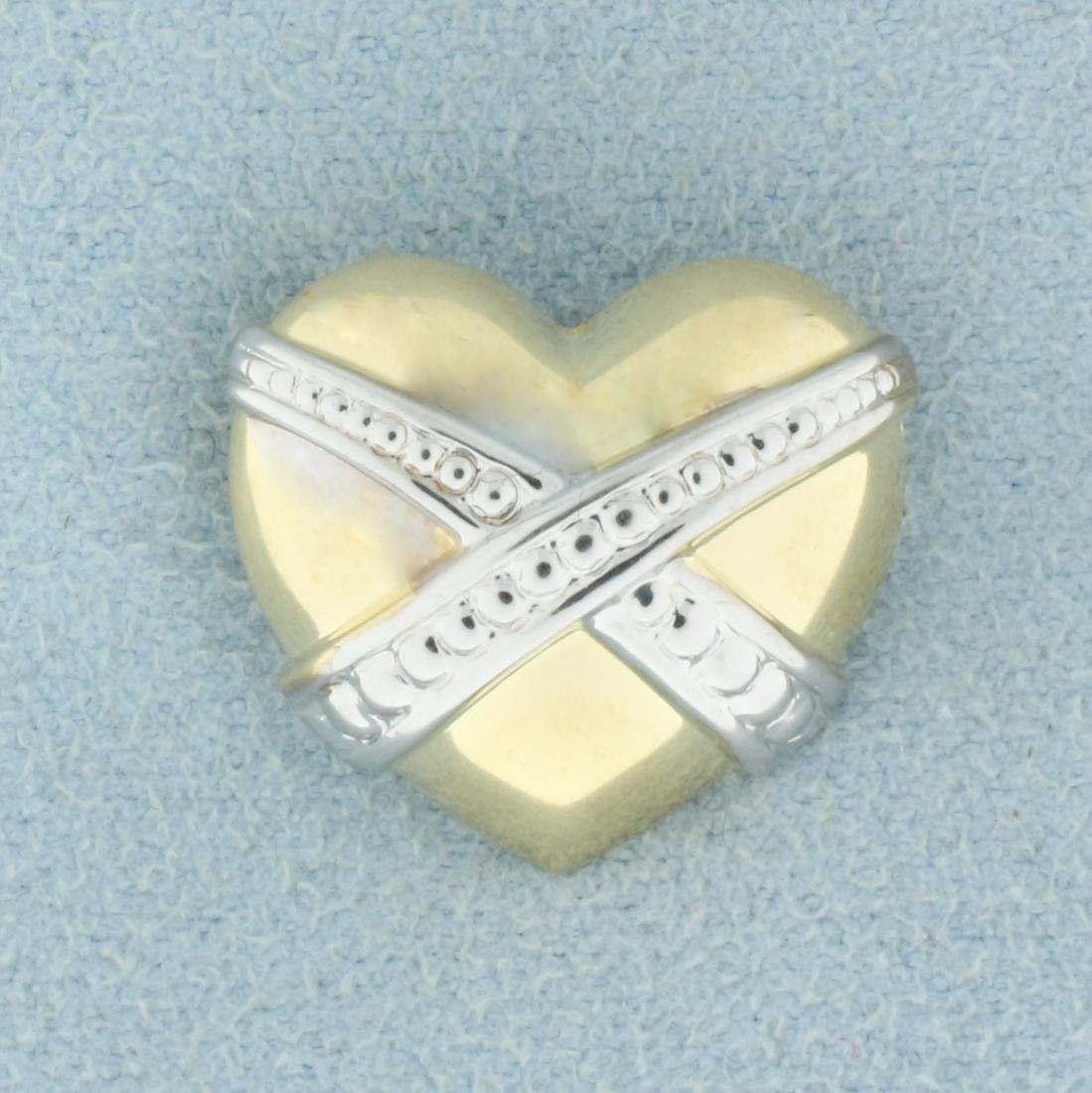 Heart Pendant or Slide in 10K Yellow and White Gold: In 10K Yellow and White Gold. 1/2 inch long. 3/4 inch wide. 0.8g.