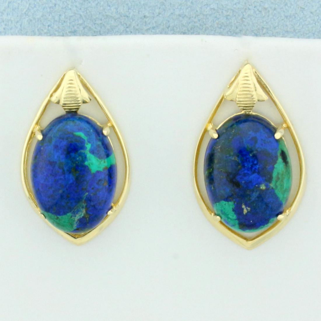 Lapis Lazuli and Malachite Earrings in 14K Yellow Gold: In 14K Yellow Gold. Each earring contains one high quality natural 14x10mm cabochon Lapis Lazuli and Malachite gemstone where the two minerals have grown together in one stone for a very unique and be