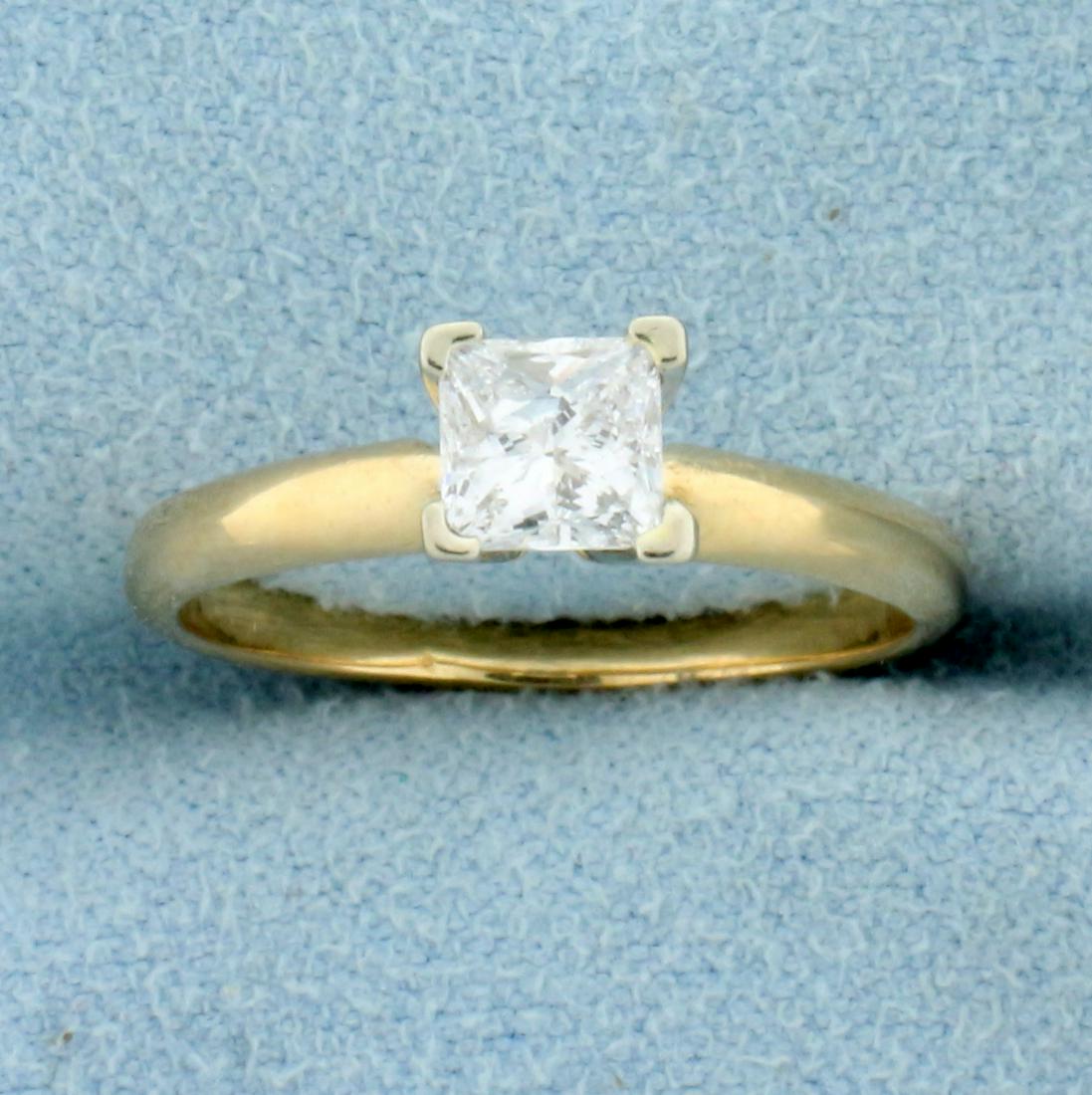 Over 1/2ct Princess Diamond Solitaire Engagement Ring: In 14K Yellow and White Gold (yellow gold band, white gold prongs). Contains one high quality 4.5mmx4.6mm princess cut diamond, .57ct, H color/SI2 clarity. Completely eye clean, great cut for lots of 