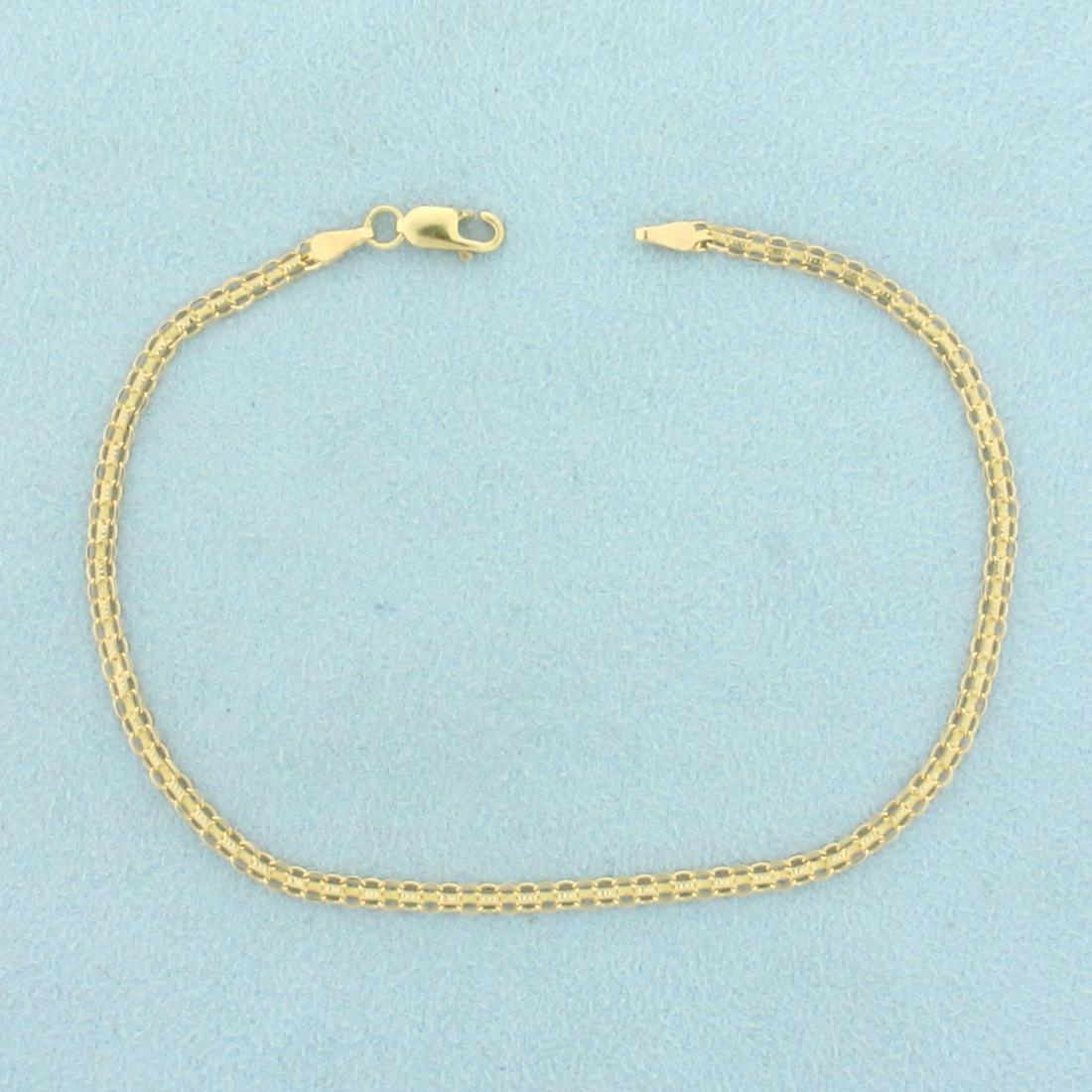 Italian Made 7 1/2 Inch Bismarck Link Chain Bracelet in: In 14K Yellow Gold. 7 1/2 inches long, 2.4mm wide, with a lobster clasp. 2.0g.