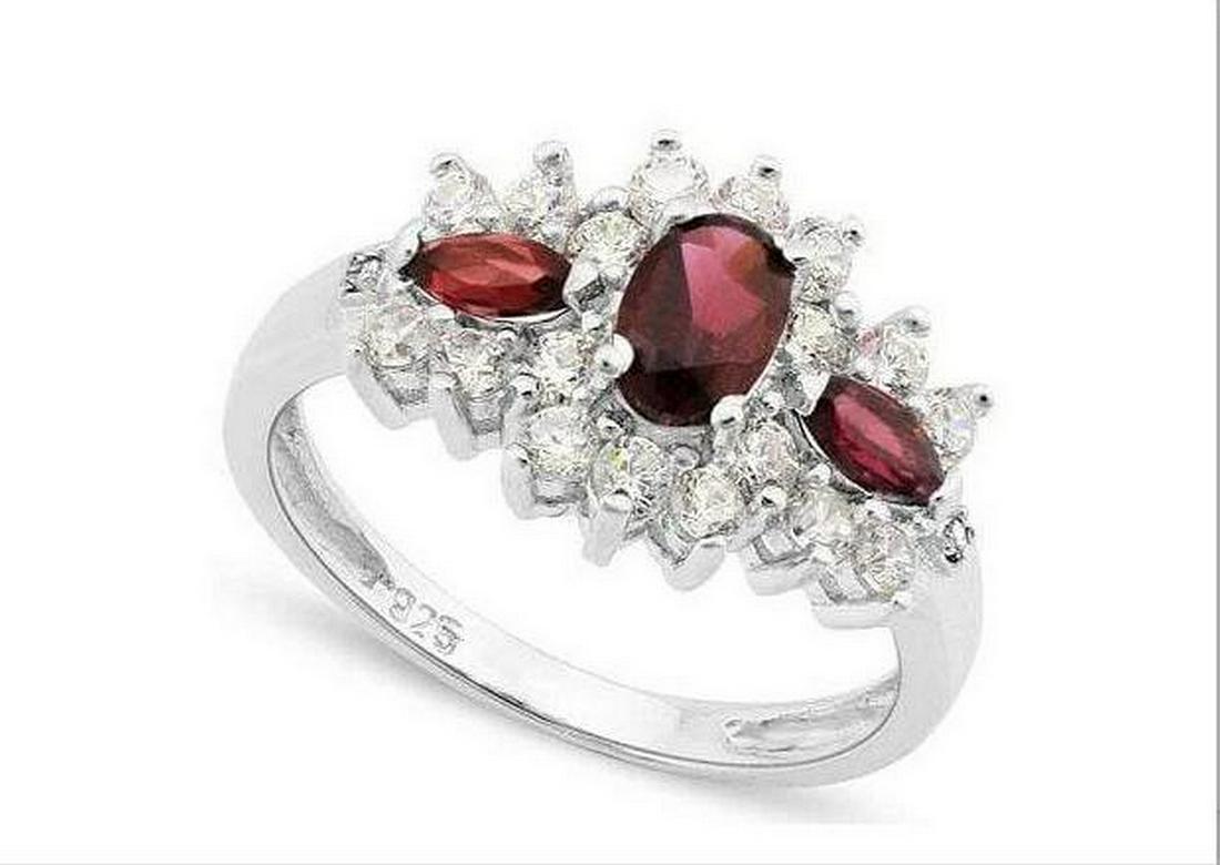 Garnet 3-Stone Ring in Sterling Silver: Oval cut .8ct garnet gemstone vintage inspired ring, accented with 2-marquise cut garnet gemstones, .63ctw, and round cut white sapphires. Size 6. Set in platinum over sterling silver, 2.8g.