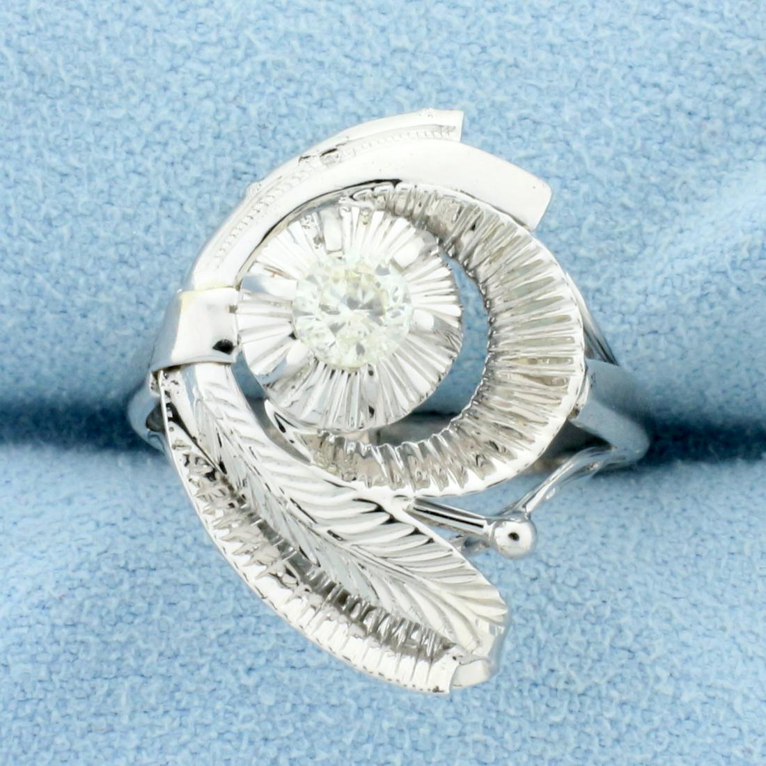 Feather Design Diamond Solitaire Ring in 14K White Gold: In 14K White Gold. Contains a high quality .2ct diamond, SI clarity/J color. Size 5. Matching earrings lot 11023a. 3.0g.