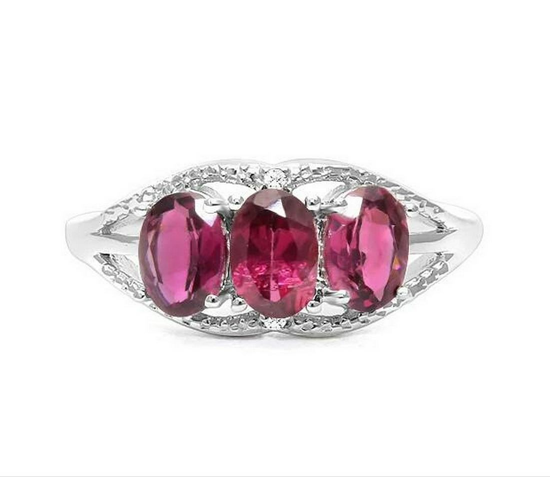 Rhodolite Garnet & Diamond 3-Stone Ring in Sterling: Ring contains 3-oval cut rhodolite garnet gemstones, 1.54ctw, accented with .01ctw genuine diamonds. Size 8. Set in platinum over sterling silver, 2.6g.