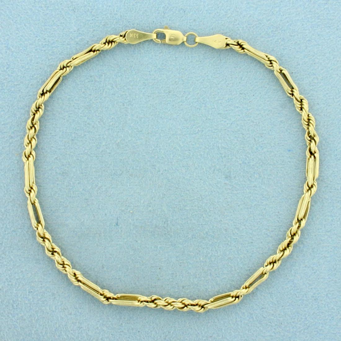 8 1/2 Inch Figaro Rope Link Anklet in 14K Yellow Gold: In 14K Yellow Gold. Lobster clasp. 8 1/2 inches long. 3.1mm wide. 2.8g
