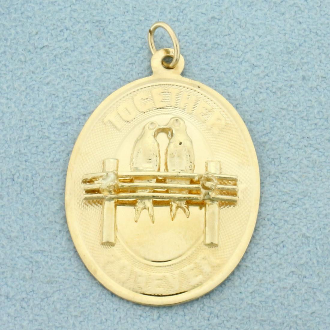 Together Forever Love Bird Charm in 14k Yellow Gold: In 14k Yellow Gold. 1 1/4 inches long including jump ring, 3/4 inch wide. 3.0g.