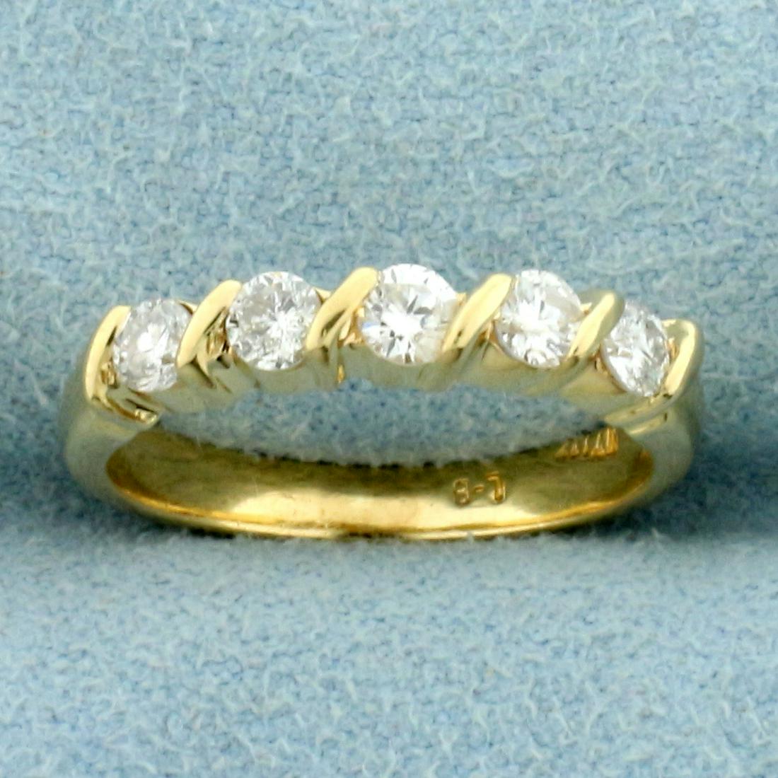1/2ct TWW Diamond Wedding or Anniversary Band Ring in: In 14K Yellow Gold. Contains five high quality .1ct Diamonds, SI clarity/H color. Size 5 1/4. 2.9g