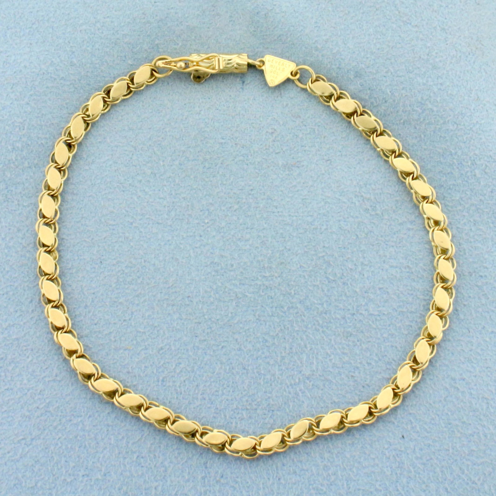 7 Inch Designer Sparkle Link Chain Bracelet in 14K: In 14K Yellow Gold. Links reflect light at viewer to give a shiny/sparkle look. Safety clasp. 7 inches long. 3.2mm wide. 3.2g