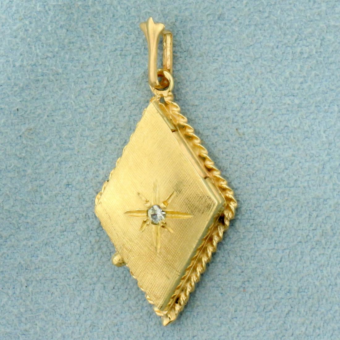 Vintage Diamond Locket Pendant in 14K Yellow Gold: In 14K Yellow Gold. Contains one high quality .02ct Diamond, VS clarity/G color. 1 1/4 inches long including bale. 5/8 inch wide. 3.5g
