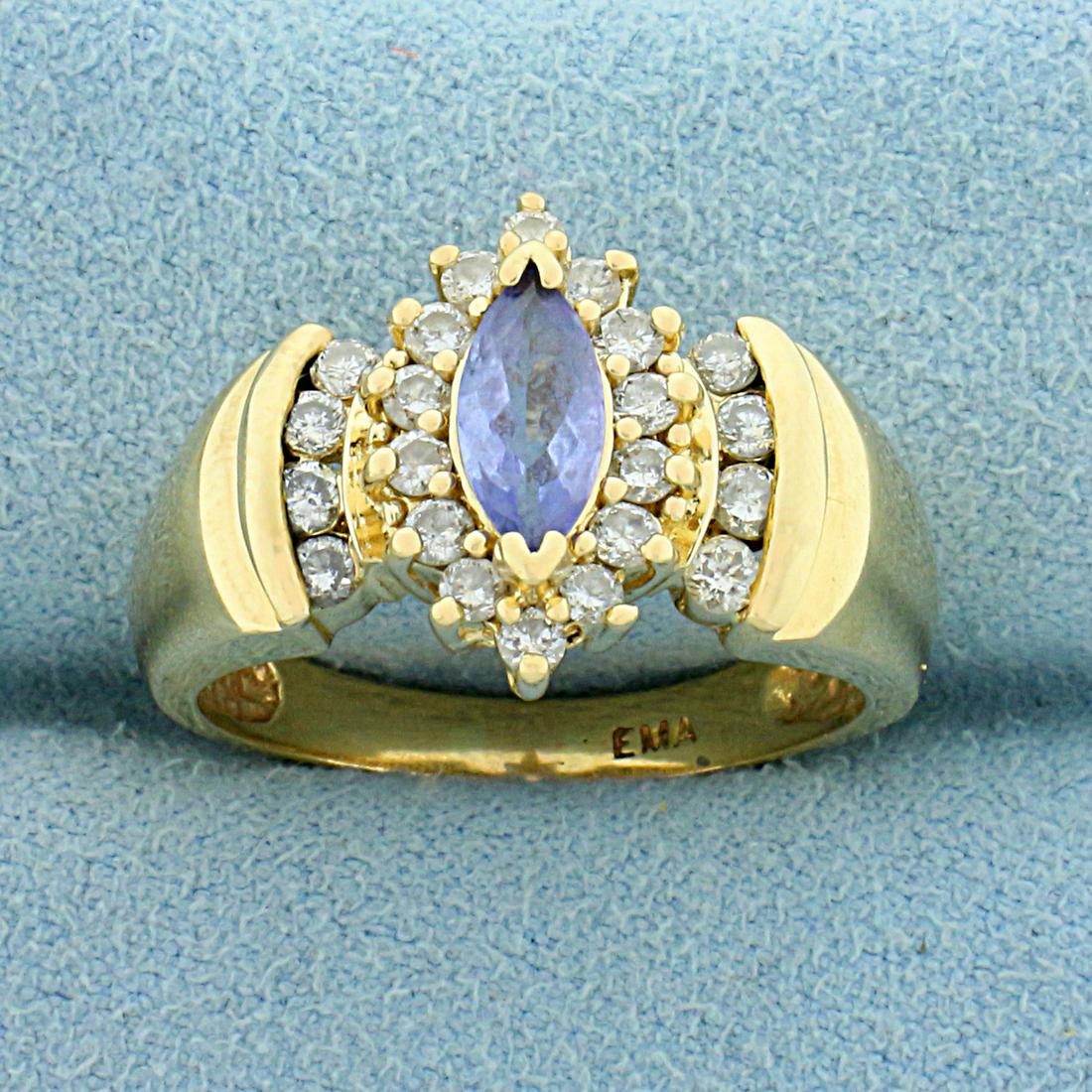 1ct TW Tanzanite and Diamond Ring in 14K Yellow Gold: In 14K Yellow Gold. Contains one high quality natural 7x4mm marquise shaped Tanzanite gemstone with pastel purple color and excellent clarity. Also contains twenty two .03ct diamonds, SI clarity/H col