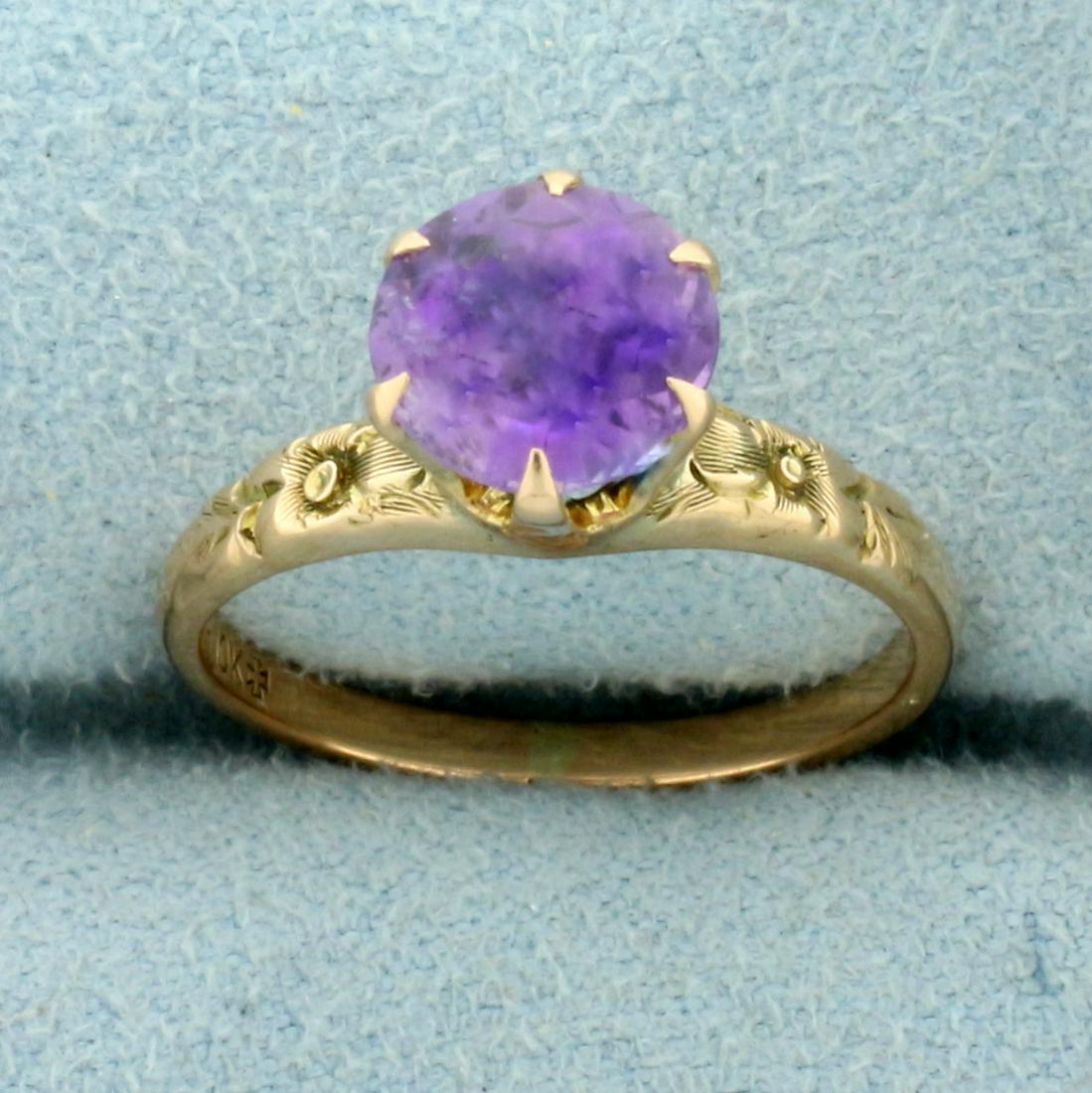 Vintage 1.5ct Amethyst Solitaire Ring With Engraved: In 10K Yellow Gold. Contains one high quality natural 1.5ct round Amethyst gemstone with intense purple color and excellent clarity. Size 6. 2.7g