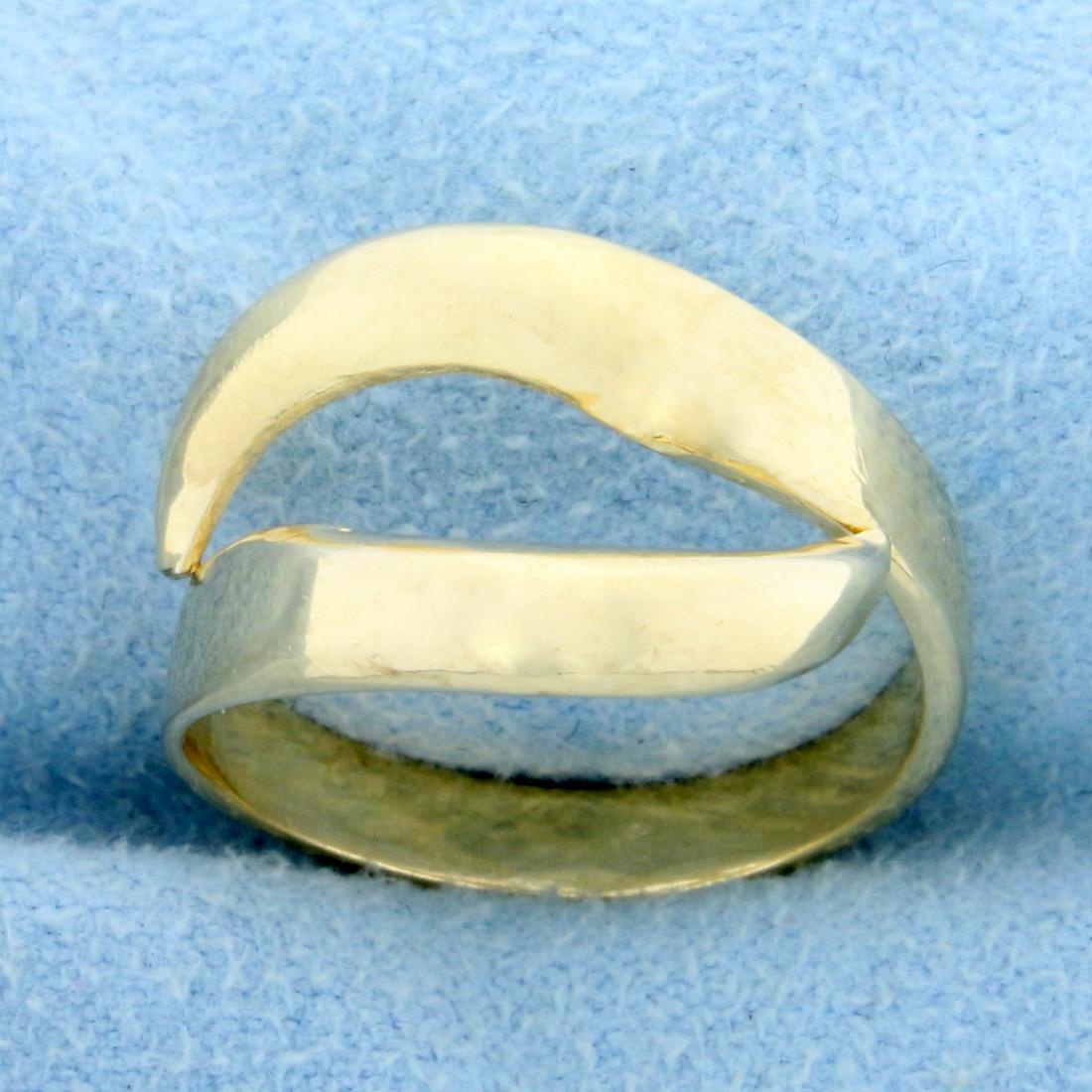 Modern Wave Design Ring in 14K Yellow Gold: In 14K Yellow Gold. 13mm wide at its widest point. Size 6 1/2. 3.9g.