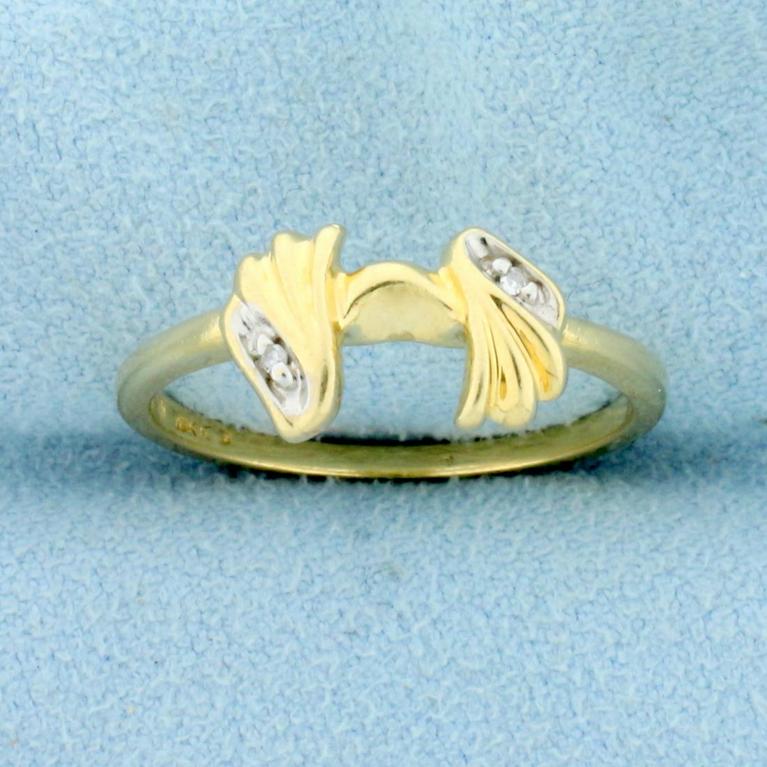 Unique Design Diamond Ring in 10K Yellow Gold: In 10K Yellow Gold. Contains two high quality 1/2pt diamonds. Size 7. 1.9g