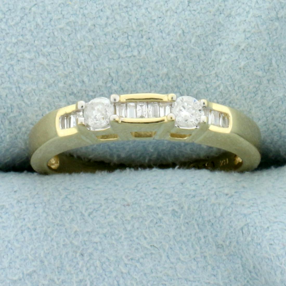1/2ct TW Round and Baguette Diamond Wedding Band Ring: In 14K Yellow Gold. Contains two high quality round and eleven baguette high quality Diamonds, 1/2ct TW, SI clarity/H color. Size 7 1/4. 3.3g