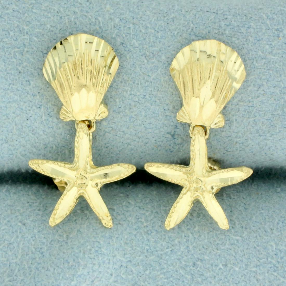 Starfish and Seashell Dangle Earrings in 14K Yellow: In 14K Yellow Gold. 7/8 inch long. 1/2 inch wide. Friction backs. 2.0g