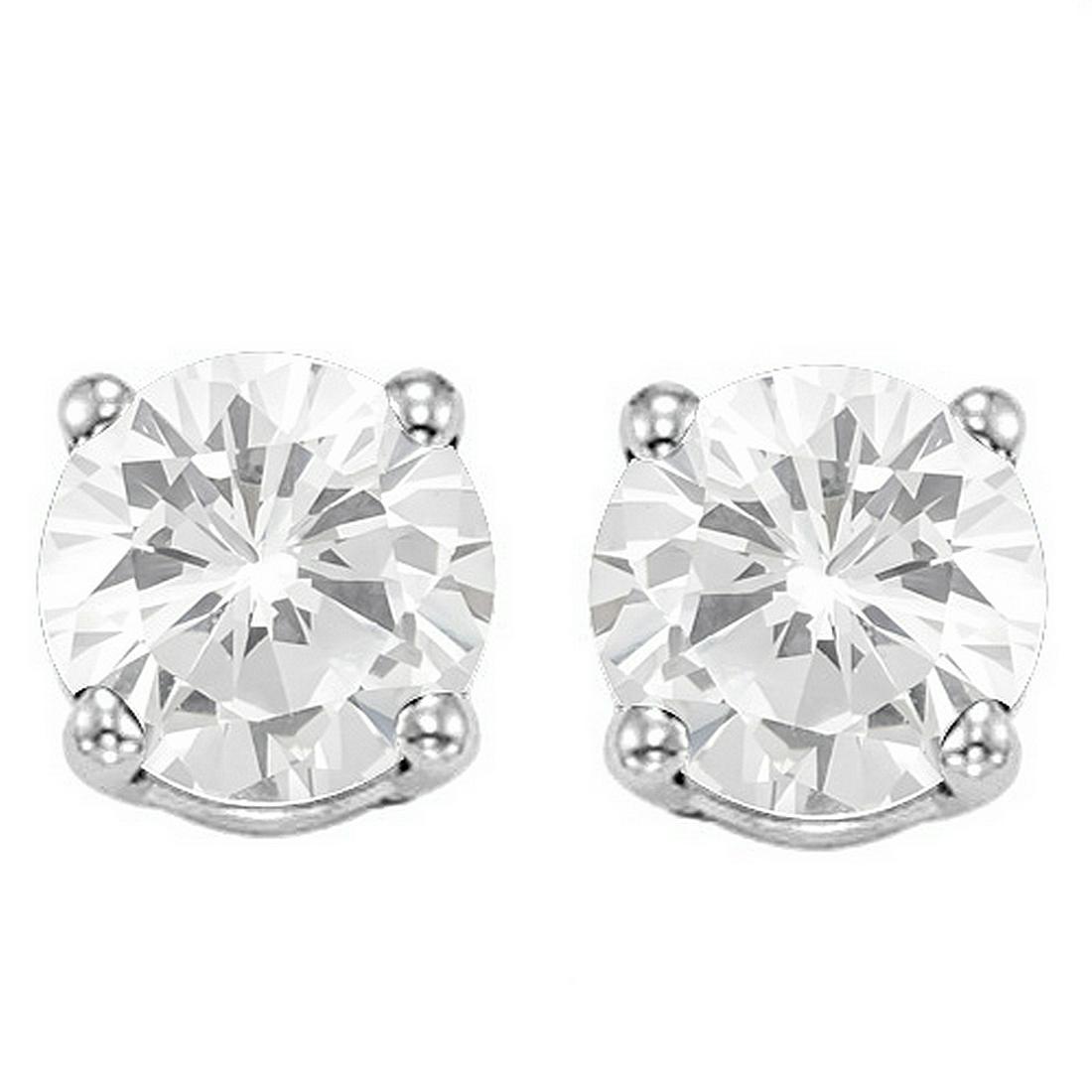 6MM White Topaz Stud Earrings in Sterling Silver: Set in platinum over .925 sterling silver, 4-prong basket mountings with friction backs. Contains 2-6mm round cut genuine White Topaz gemstones with excellent clarity and clear ice color. 1.3g