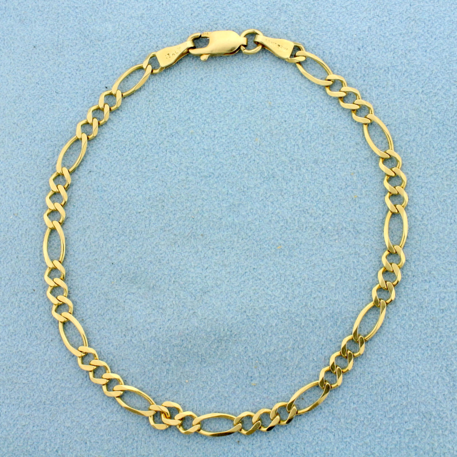 Italian Made 7 1/2 Inch Figaro Link Chain Bracelet in: In 14K Yellow Gold. Lobster clasp. 7 1/2 inches long. 3.7mm wide. 3.1g