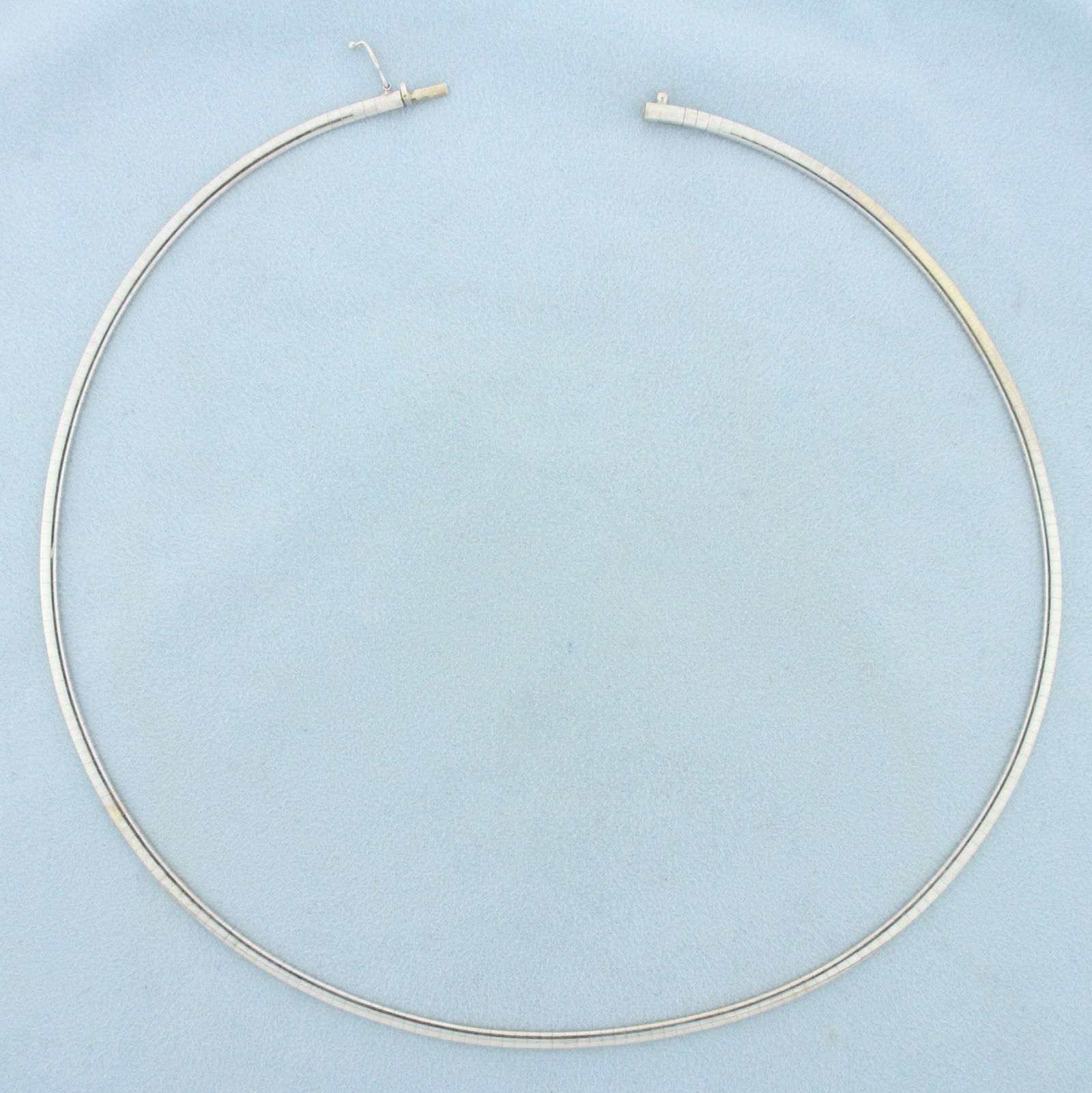 18 Inch Omega Link Necklace In 14K White Gold: In 14K White Gold. 18 inches long, 3mm wide. Safety Clasp. 17.9g