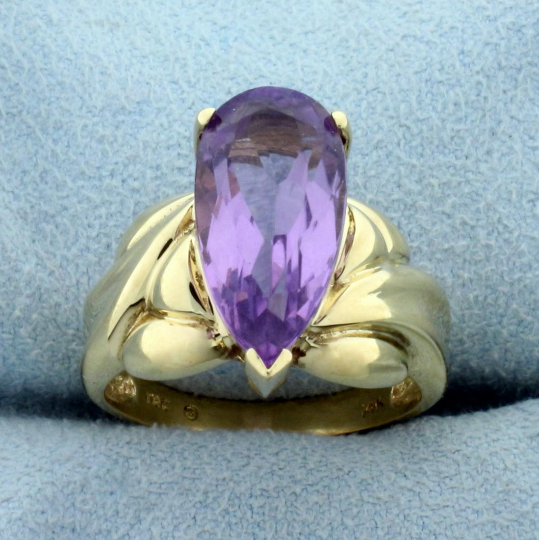 3ct Amethyst Solitaire Ring in 14K Yellow Gold: In 14K Yellow Gold. Contains one high quality natural 16x8mm pear cut Amethyst gemstone with bright purple color and excellent clarity. Size 7. 5.5g