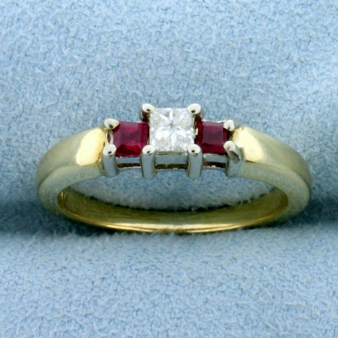 Ruby and Diamond Ring in 14K Yellow Gold: In 14K Yellow Gold. Contains two high quality natural 2.25mm Ruby gemstones with intense red color and excellent clarity. Also contains one 1/5ct princess cut Diamond, J color/I1 clarity. Size 7. 4.2g