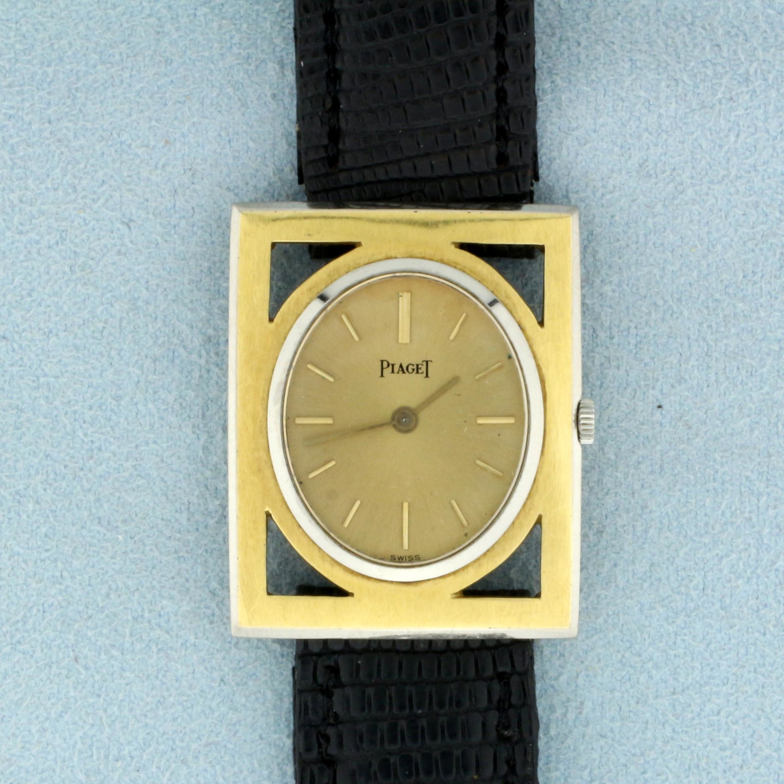 Antique Mens Piaget Manual Wind Wristwatch in Solid 18k: Case in solid 18k yellow and white gold. 18 jewel manual wind movement runs great. Model 089009. Case is 30mmx25mm, 9 inches long. 27.4g
