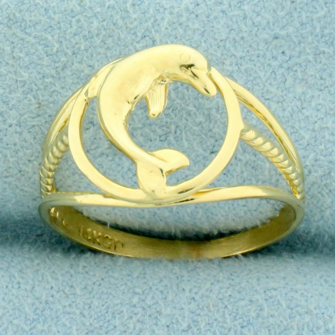 Dolphin Ring in 14K Yellow Gold: In 14K Yellow Gold. Size 7 1/2. 12mm wide. 2.1g