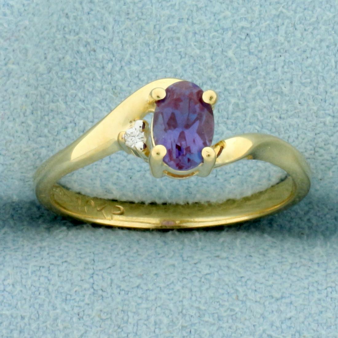 1/2ct Lab Alexandrite and Diamond Bypass Ring in 10K: In 10K Yellow Gold. Contains one high quality Lab 6x4mm Lab Alexandrite gemstone with excellent clarity and intense color change from blue to red depending on light source. Also contains one high qual