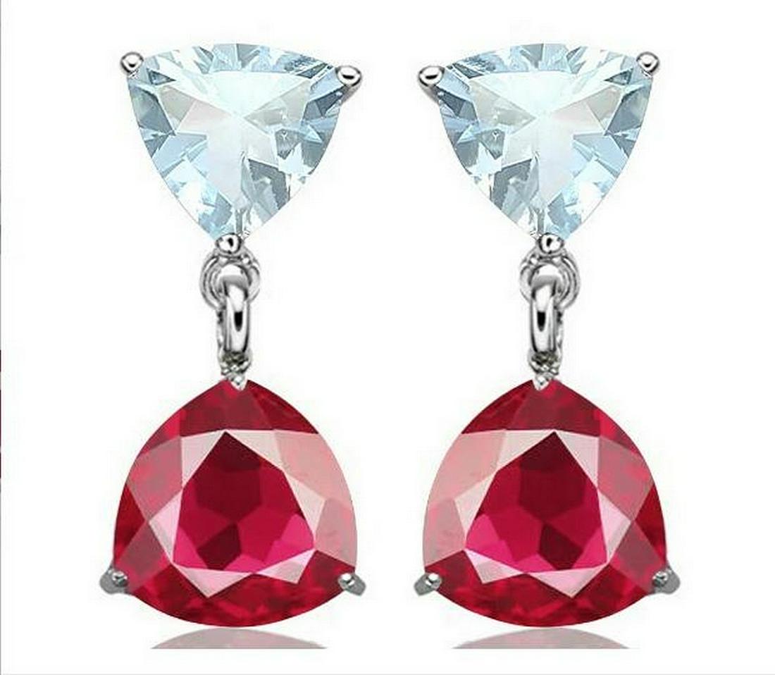 Aquamarine & Ruby Dangle Earrings in Sterling Silver: Trillion cut 6mm natural aquamarine gemstone earrings with 7mm lab created ruby gemstone dangle accents. Set in platinum over sterling silver with friction backs, 2.7g.