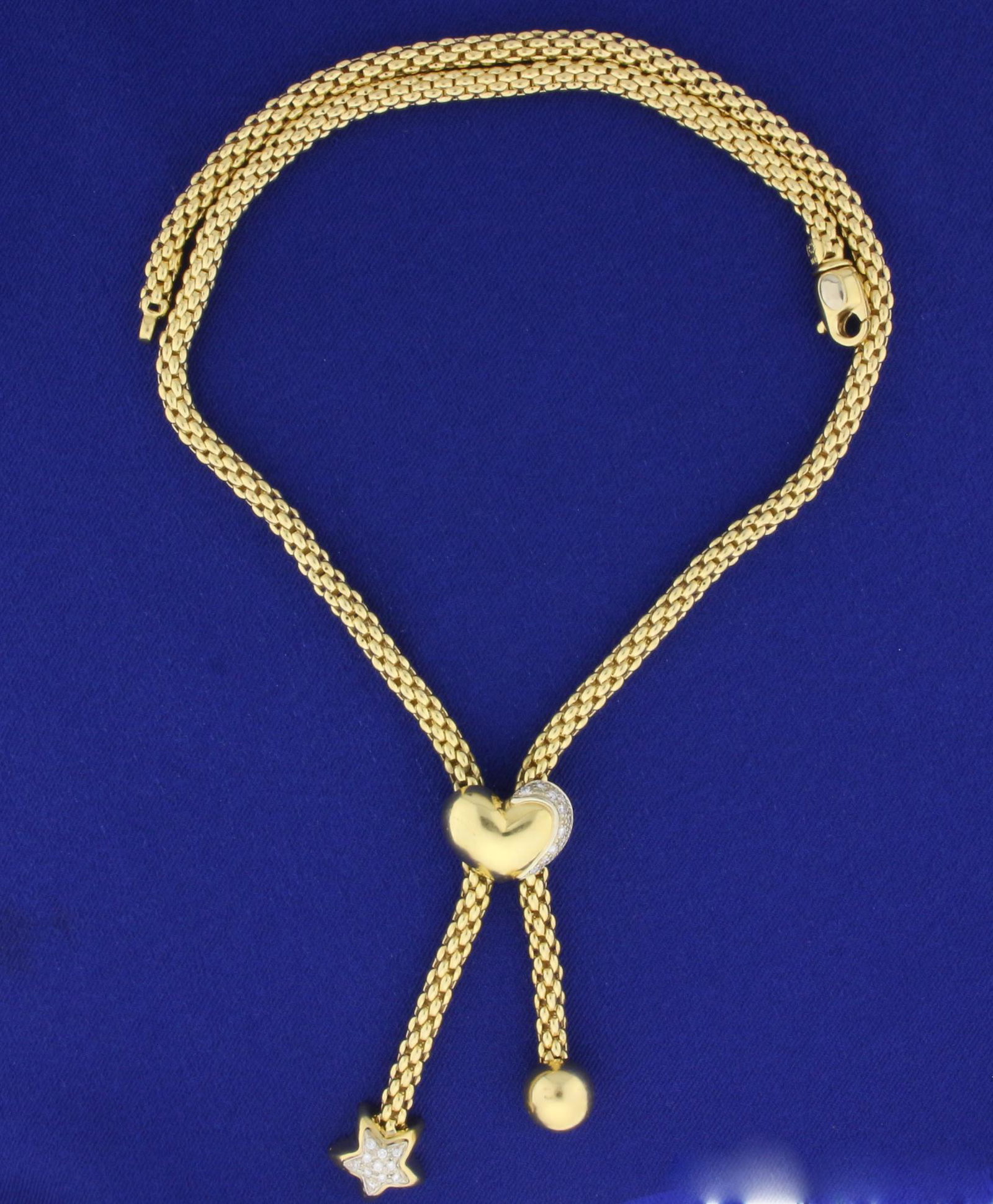 Italian Made Diamond Heart and Star Tassel Necklace in: In 14k Yellow Gold. Contains twenty- two high quality .01ct round Diamonds, VS clarity/F color. 18 inches long with an additional 2.5 inch drop for star. Chain is 4.6mm wide. Lobster clasp. 40.9g