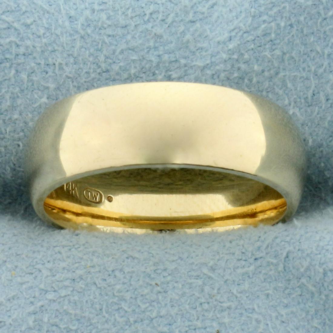 Woman's Wedding Band Ring in 14K Yellow Gold: In 14K Yellow Gold. 6.1mm wide. Size 6 1/4. 7.2g.