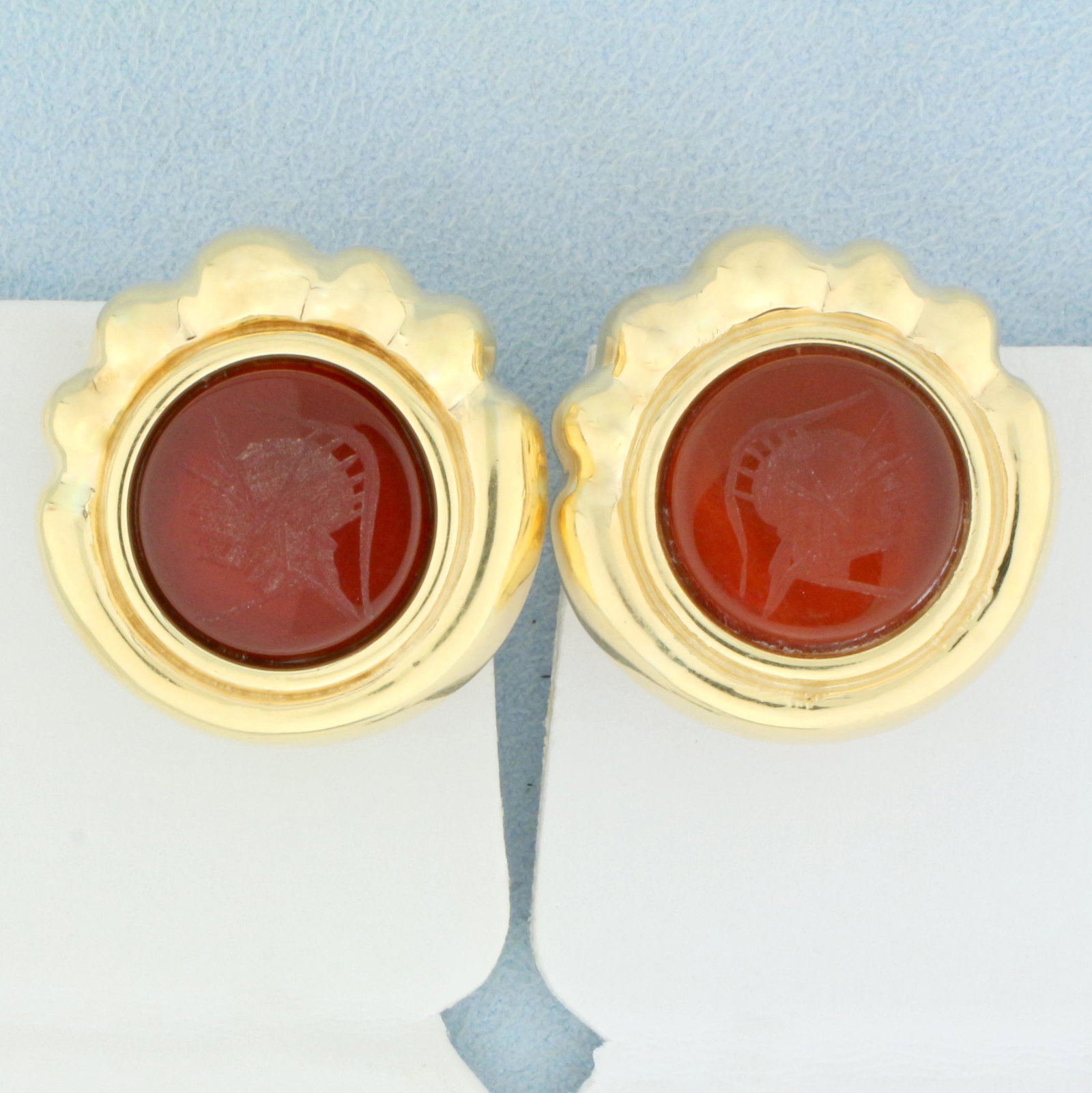 Large Statement Cameo Carnelian Earrings in 14K Yellow: In 14K Yellow Gold. Each contains one high quality natural 15mm round Carnelian gemstone with cameo of helmeted soldier. 1 inch diameter. 10.8g