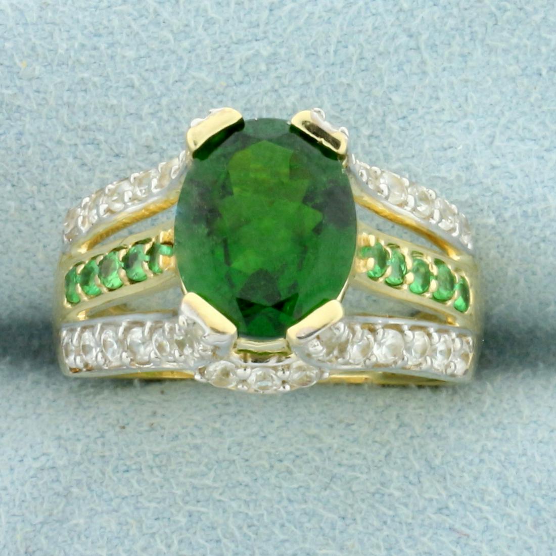 4ct TW Tsavorite Garnet and White Sapphire Ring in 10K: In 10K Yellow Gold. Contains one 10x8mm oval and ten 1.5mm round high quality natural Tsavorite Garnet gemstones with intense green color and excellent clarity. Also contains thirty-eight high quality