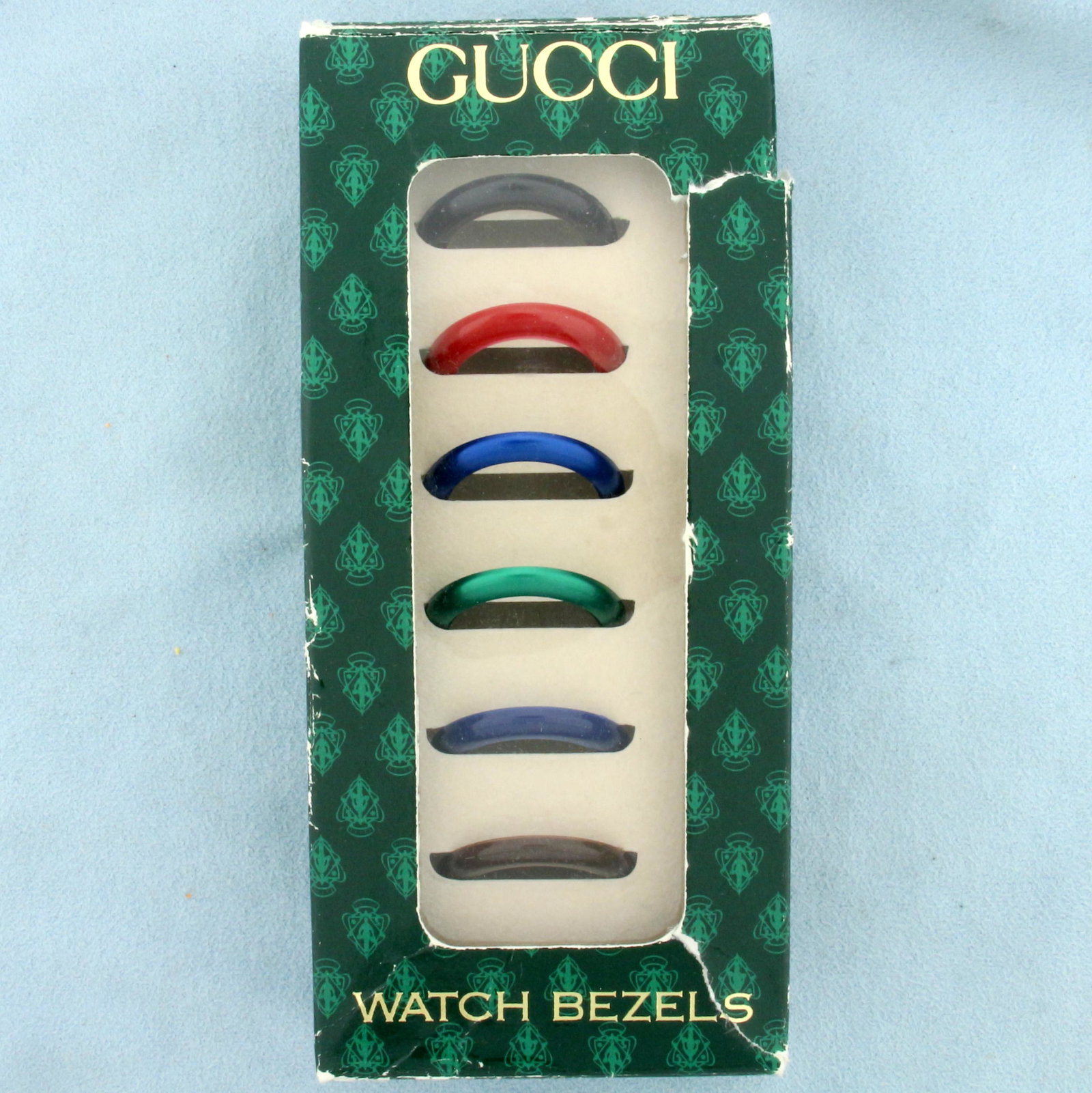 Authentic Vintage Gucci 25mm Watch Bezels In Classic: Comes with original box. Contains six (classic color range) watch bezels. 25mm diameter. 3.0g