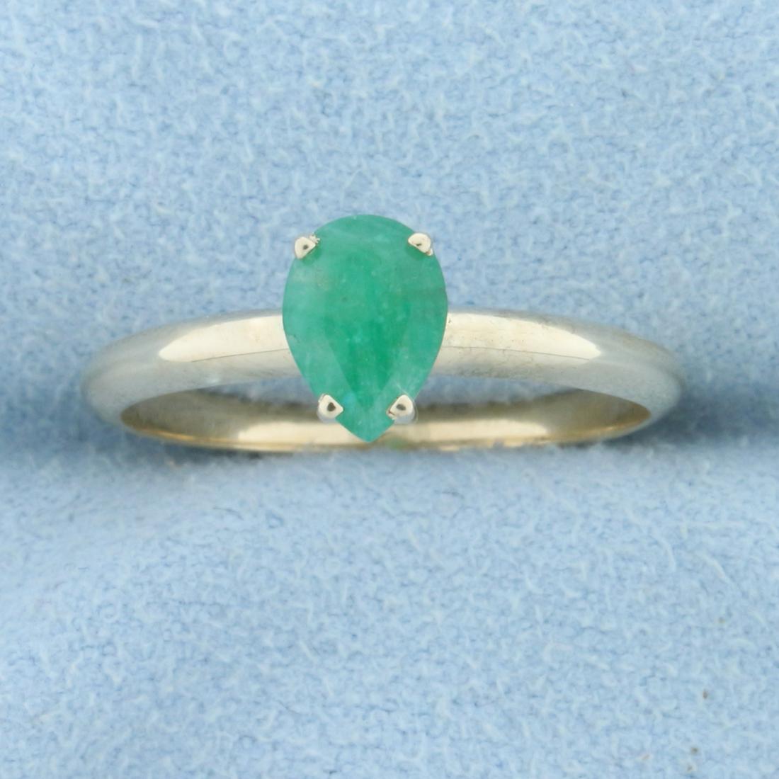 3/4ct Pear Solitaire Natural Emerald Ring in 10K Yellow: In 10K Yellow Gold. Contains one high quality natural 7 x 5mm pear cut Emerald gemstone with vibrant green color. Size 7 1/2. 1.6g.