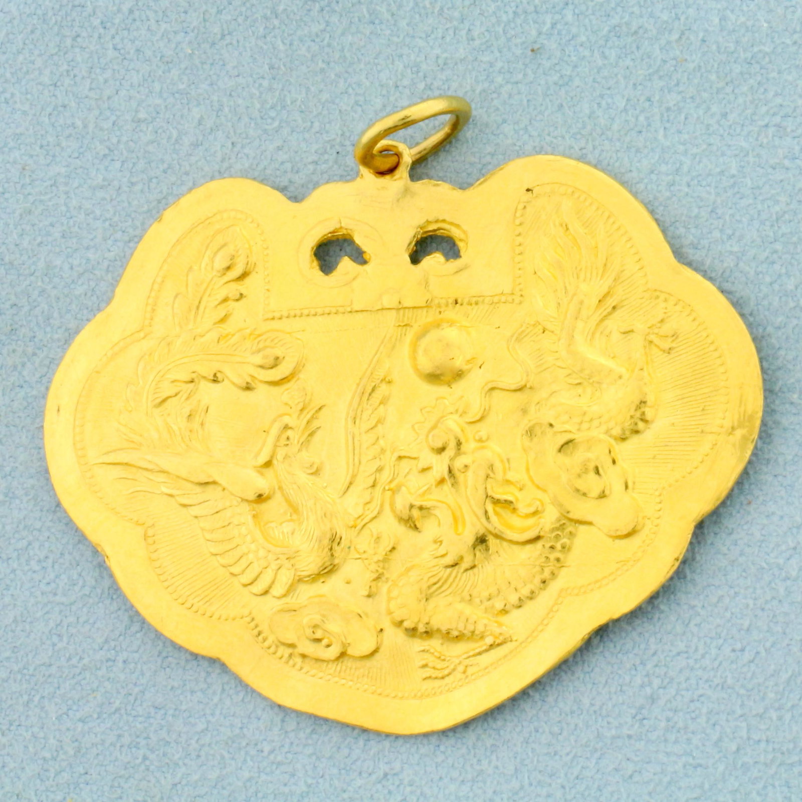 Vintage Chinese Dragon Pendant in 22K Yellow Gold: In 22K Yellow Gold. 1 1/2 inches long including bale. 1 3/4 inches wide. 15.0g