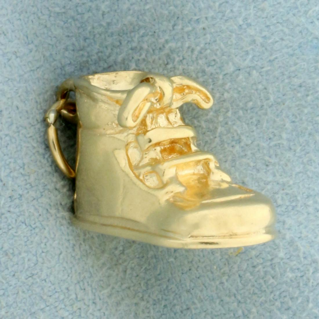 Vintage High Top Shoe Charm or Pendant in 14K Yellow: In 14K Yellow Gold. 1 inches long including jump ring. 1/2 inch wide. 5.5g