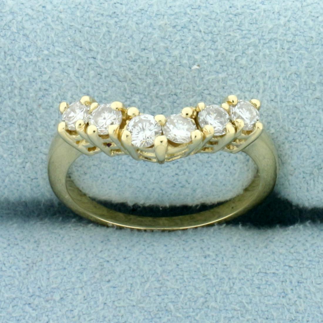 2/3ct TW Curved Diamond Wedding Band Ring in 14K Yellow: In 14K Yellow Gold. Contains six high quality round brilliant cut Diamonds, 2/3cgt TW, SI clarity/H color. Band is designed to wrap around and "hug" diamond engagement ring with round center stone. Si