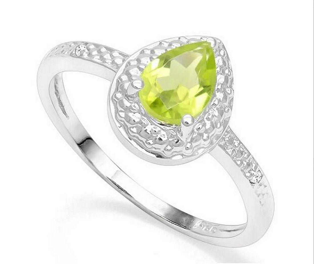 Peridot & Diamond Halo Ring in Sterling Silver: Pear cut .7ct peridot gemstone ring accented with .01ctw genuine diamonds. Size 7. Set in platinum over sterling silver, 2.1g.