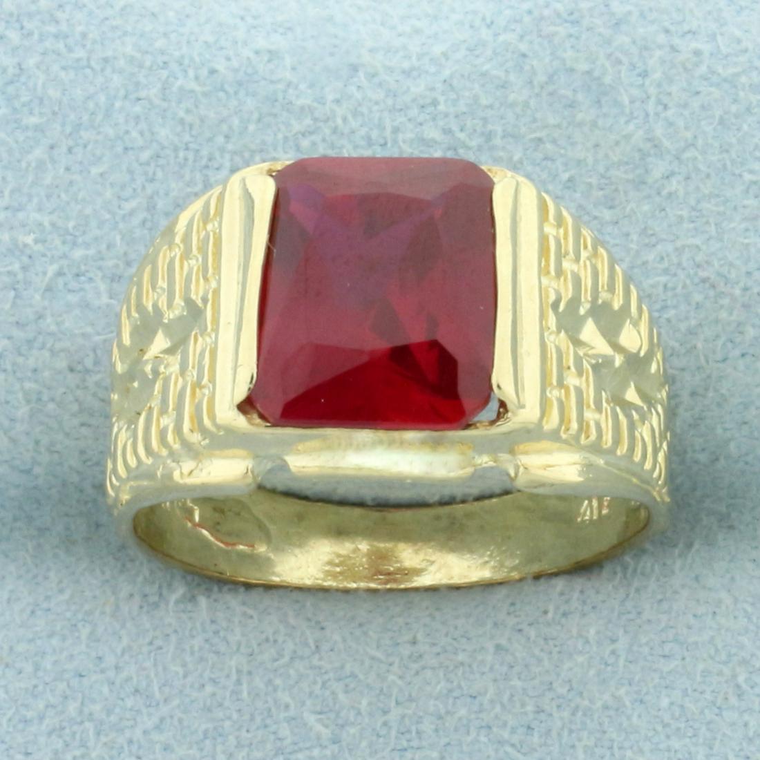 Men's 5ct Lab Ruby Solitaire Ring in 10K Yellow Gold: In 10K Yellow Gold. Contains a high quality 11x9mm cushion cut Lab Ruby gemstone with intense red color and excellent clarity. Size 9 1/2. 5.3g