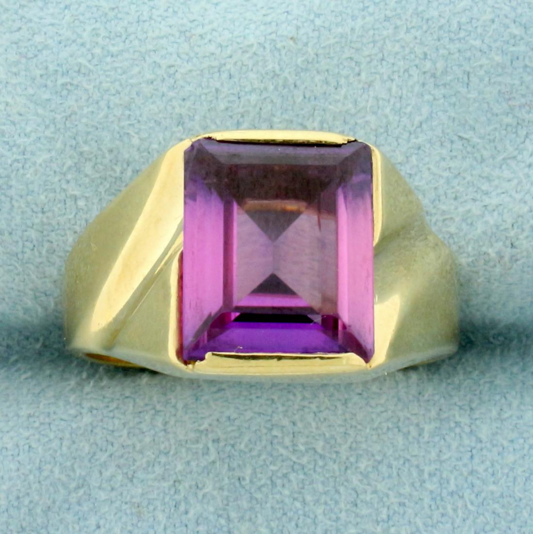 5ct Amethyst Solitaire Ring inn 10K Yellow Gold: In 10K Yellow Gold. Contains one high quality natural 12x10mm emerald cut Amethyst gemstone with bright purple color and excellent clarity. Size 10. 8.4g