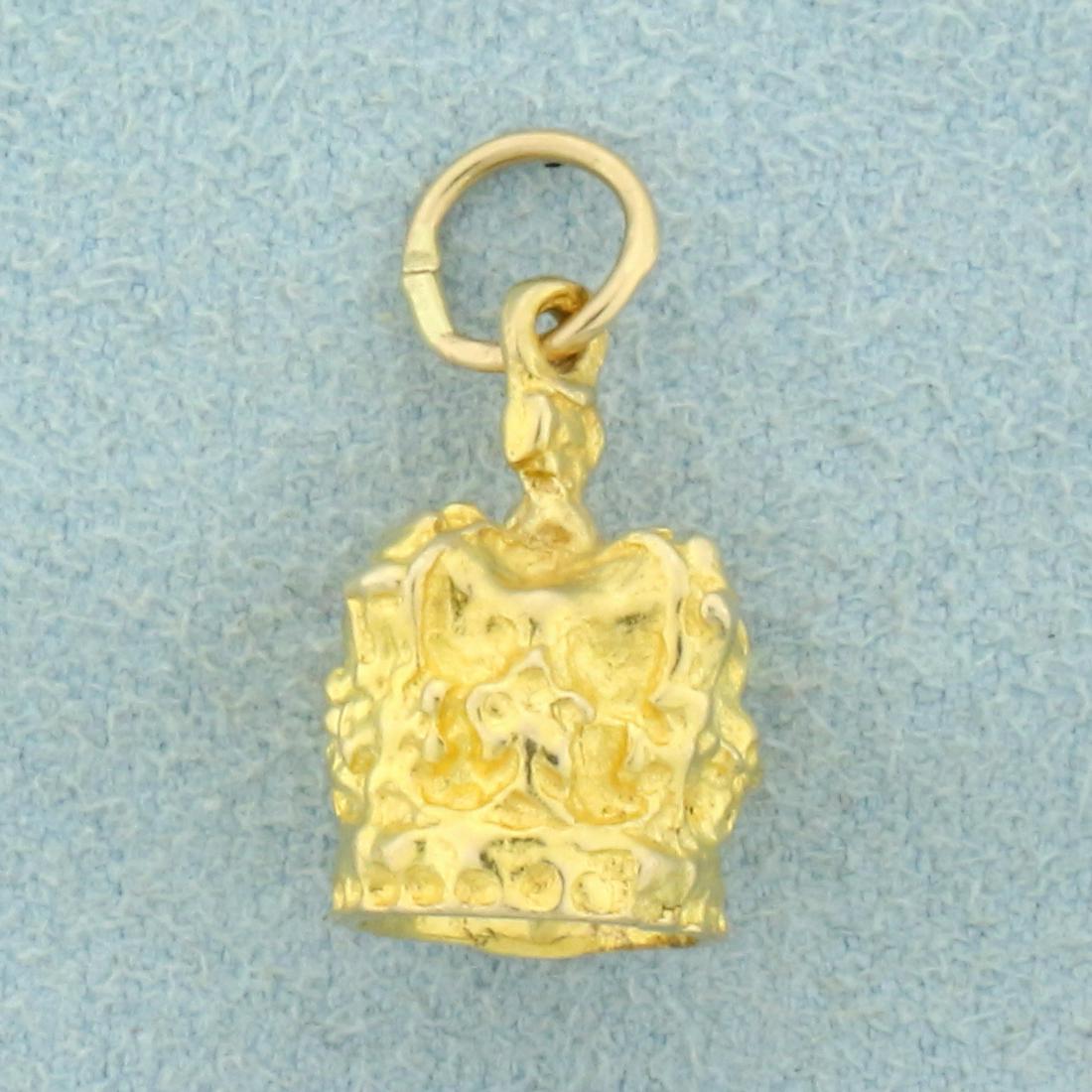 Unique Crown Pendant or Charm in 8K Yellow Gold: In 8K Yellow Gold. 3/4 inches long including jump ring, 3/8 inch wide. 4.0g.
