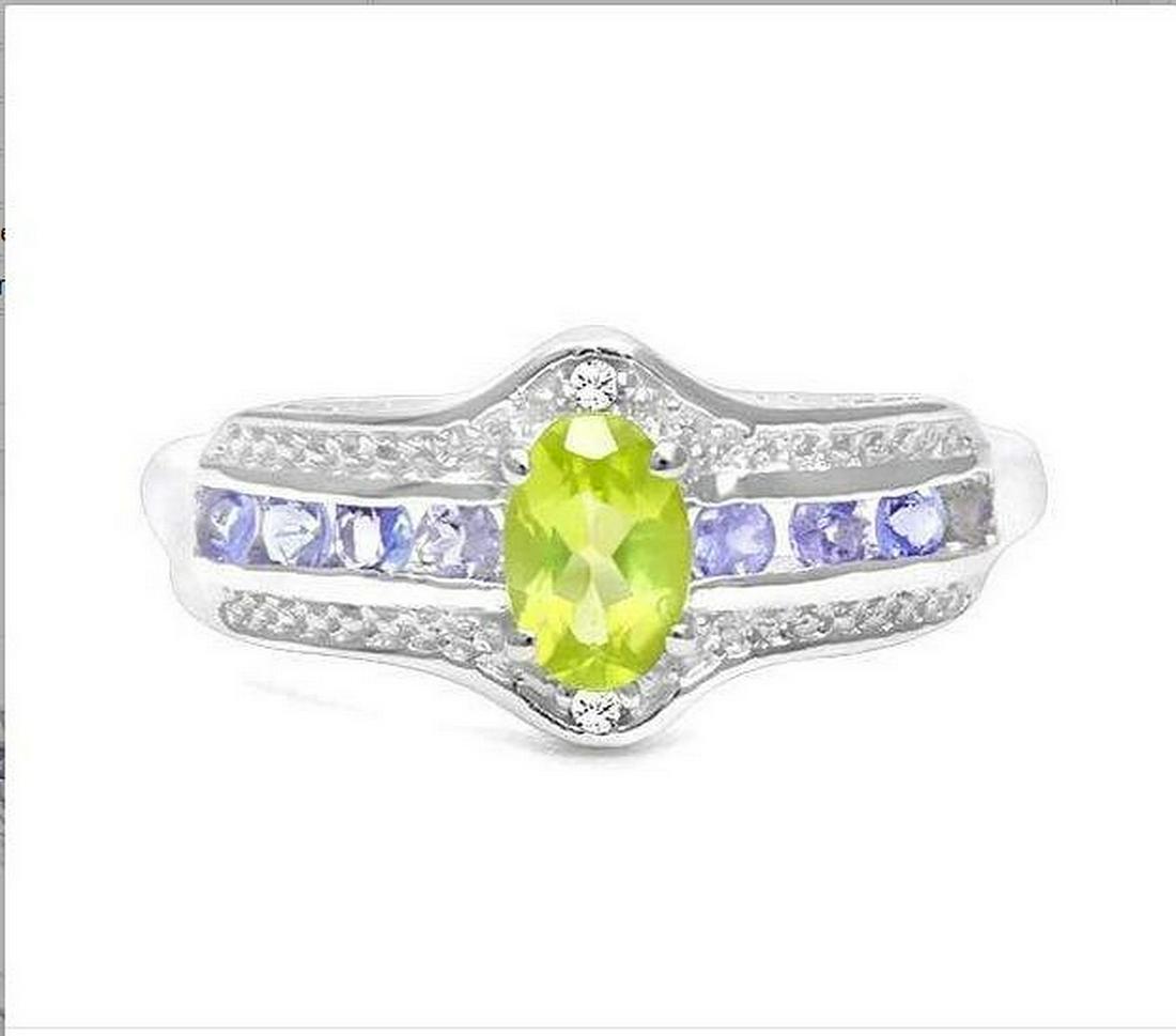Peridot, Tanzanite, & Diamond Ring in Sterling Silver: Ring contains 1-oval cut peridot gemstone, .50cts, and 8-round cut tanzanite gemstones, .32ctw, and is accented with .01ctw genuine diamonds. Size 8. Set it platinum over sterling silver, 2.8g.