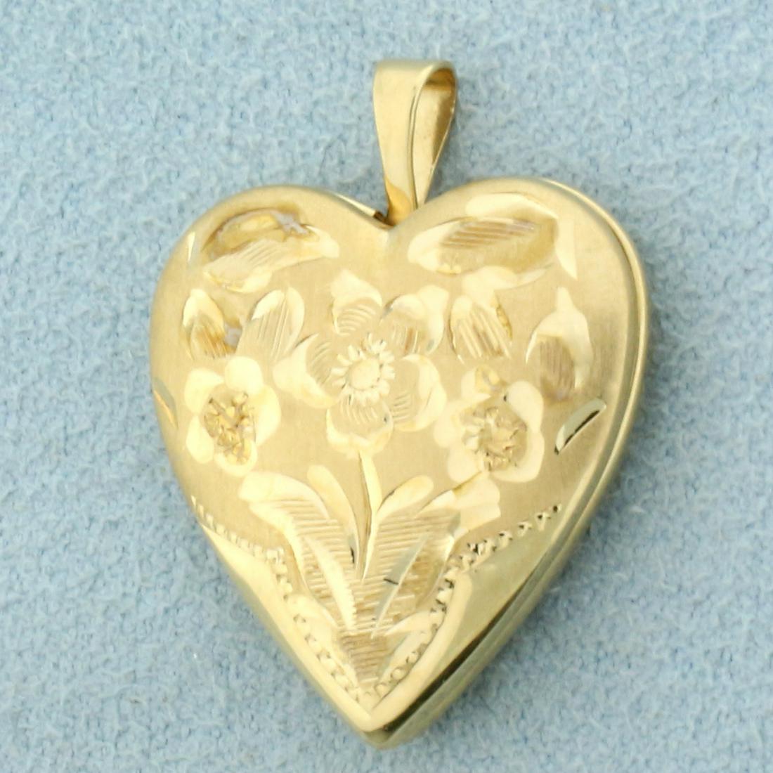 Heart Locket Flower Design Pendant in 14K Yellow Gold: In 14K Yellow Gold. 1 inch long. 3.9g.