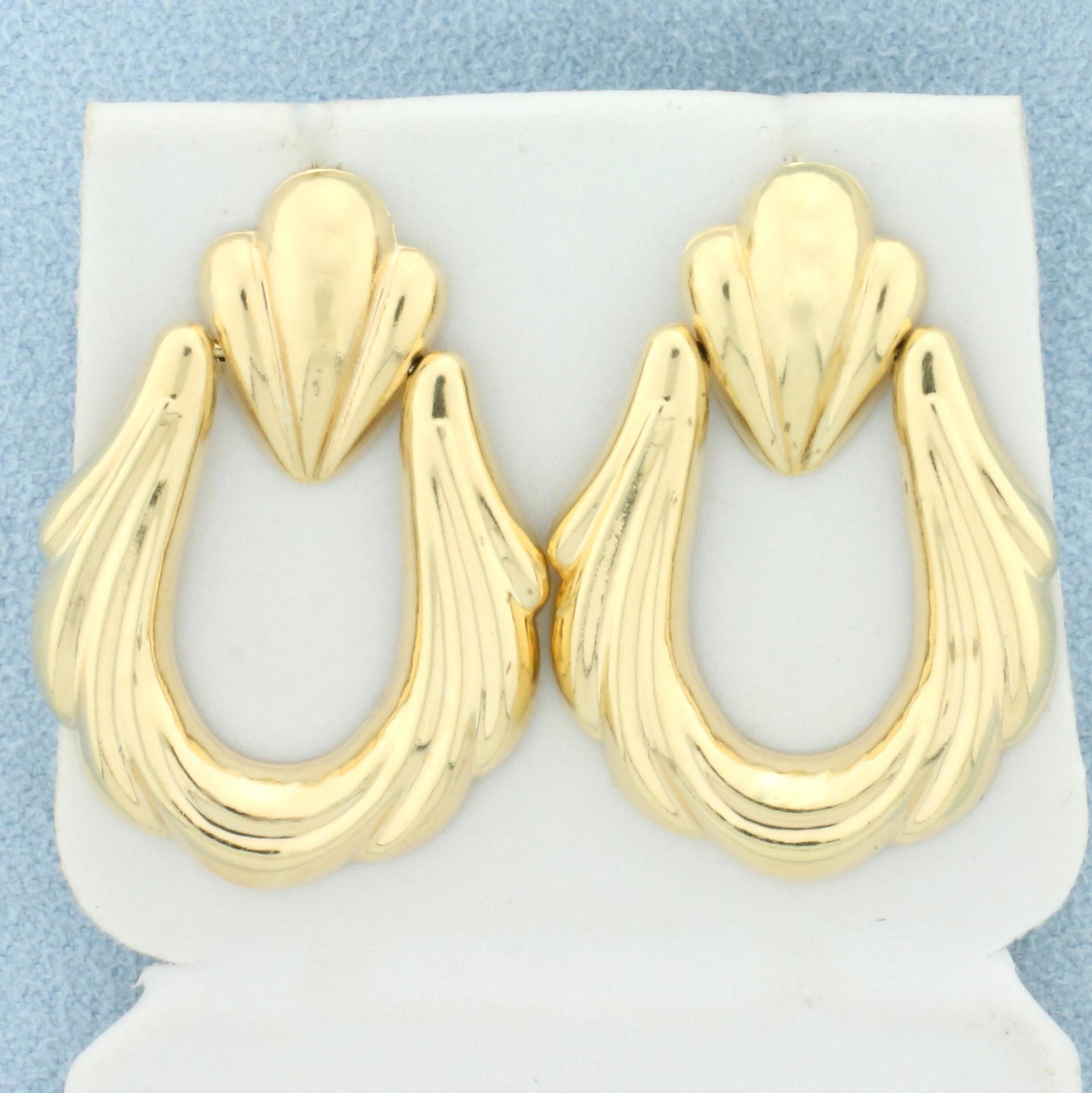 Designer Elongated Hoop Earrings in 14K Yellow Gold: In K Yellow Gold. 1 1/4 inch long. Does not come with friction backs. 2.4g.
