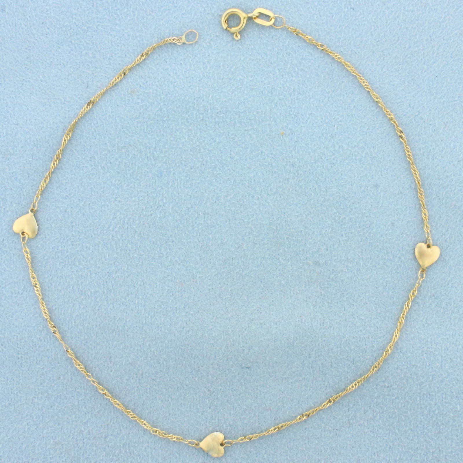 Italian Made Heart Chain Anklet in 14K Yellow Gold: In 14K Yellow Gold. Twisting Curb Link. 10 inch long. 1.35mm thick. 1.3g.